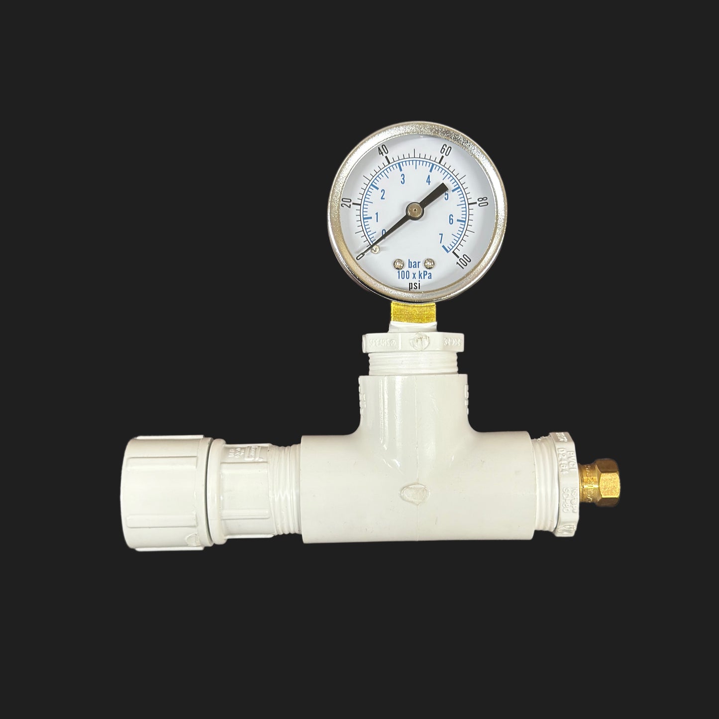 White pressure regulator with gauge on a black background