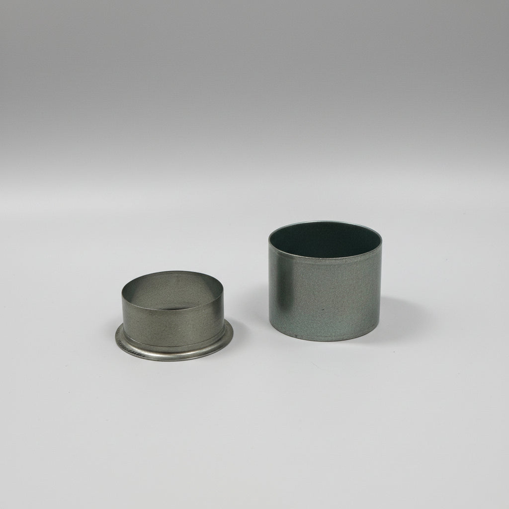 Two metal bushings on a white background