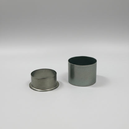 Two metal bushings on a white background